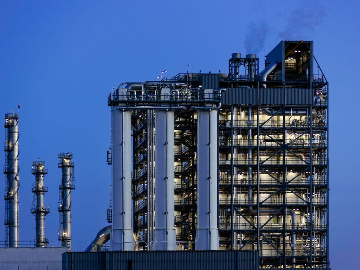 Industrial processing plant lit at dusk, the kind of facility served by on-site diesel delivery